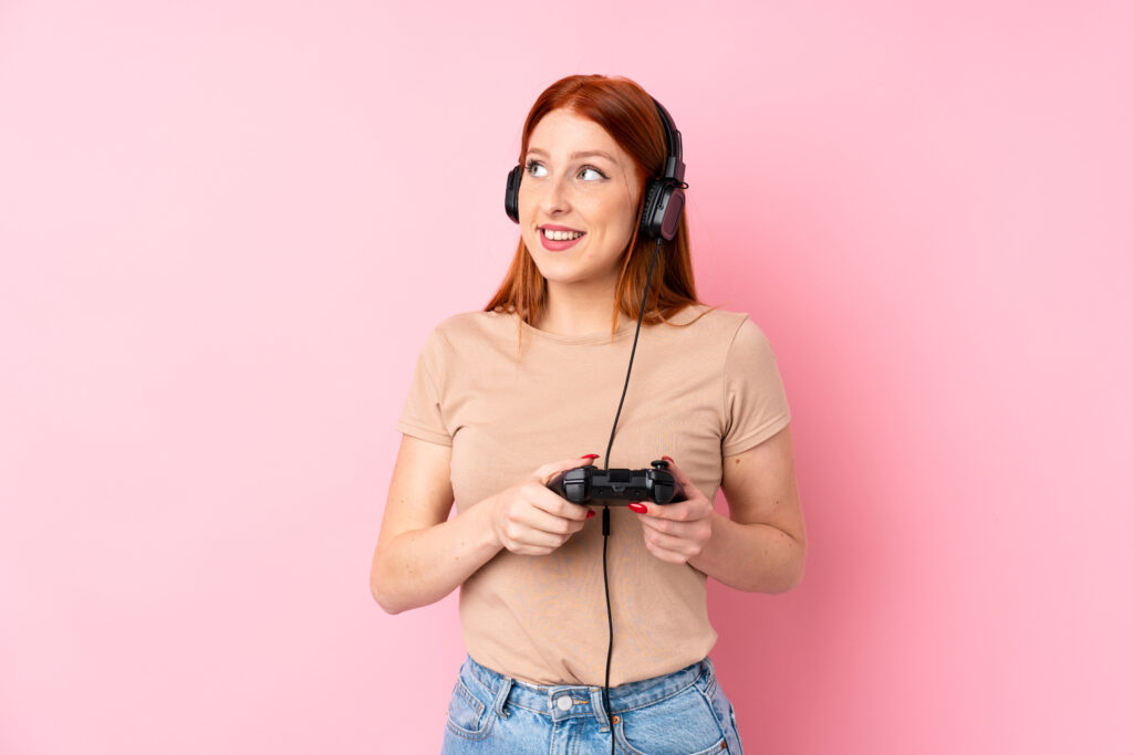 young-redhead-woman-playing-videogames